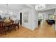 Elegant dining room featuring a large chandelier and an exquisite wooden table with matching chairs at 3899 Mount Vernon Way, Kissimmee, FL 34741