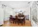 Elegant dining room featuring a large chandelier and an exquisite wooden table with matching chairs at 3899 Mount Vernon Way, Kissimmee, FL 34741