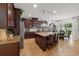 Spacious kitchen featuring a center island, granite countertops, stainless appliances, and pendant lighting at 3899 Mount Vernon Way, Kissimmee, FL 34741