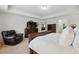 Spacious main bedroom features neutral walls, plush carpet, and elegant dark wood furniture at 3899 Mount Vernon Way, Kissimmee, FL 34741