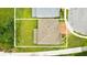 Aerial view showing property lines of a home with lush lawn, brick roof, and landscaping at 3899 Mount Vernon Way, Kissimmee, FL 34741