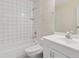 Updated bathroom with white tiled shower and white vanity with sink at 411 Sheoah Blvd # 33, Winter Springs, FL 32708