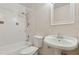 Bathroom showcasing white tile tub, toilet and pedestal sink with an oval mirror at 411 Sheoah Blvd # 33, Winter Springs, FL 32708