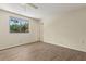 Bedroom with light colored walls, a window and wood-look flooring at 411 Sheoah Blvd # 33, Winter Springs, FL 32708
