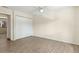 A bedroom featuring light colored walls, wood-look floors and a double door closet at 411 Sheoah Blvd # 33, Winter Springs, FL 32708