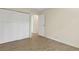 Bedroom features wood-look flooring, a double door closet and entry doorway at 411 Sheoah Blvd # 33, Winter Springs, FL 32708