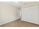 Bedroom with wood-look floors, closet and access door at 411 Sheoah Blvd # 33, Winter Springs, FL 32708