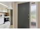 View of the front door, entry hall and partial kitchen view at 411 Sheoah Blvd # 33, Winter Springs, FL 32708