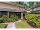Charming townhouse with a screened lanai and landscaped front entrance at 411 Sheoah Blvd # 33, Winter Springs, FL 32708