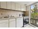 Kitchen with stainless steel appliances, ample counter space, and a window view at 411 Sheoah Blvd # 33, Winter Springs, FL 32708