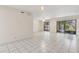 Spacious living room featuring tiled floors and a sliding door to the lanai at 411 Sheoah Blvd # 33, Winter Springs, FL 32708