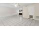Open living area with tile floors, ceiling fan, and a partial view of the kitchen at 411 Sheoah Blvd # 33, Winter Springs, FL 32708