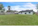 Expansive backyard with privacy fence and ample green space, perfect for outdoor activities and relaxation at 5627 Marvell Ave, Orlando, FL 32839