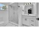 Bathroom featuring sleek walk-in shower with marble and white vanity at 5627 Marvell Ave, Orlando, FL 32839