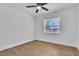 Bright bedroom featuring wood-look floors, and a window with natural light at 5627 Marvell Ave, Orlando, FL 32839