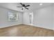 Bright bedroom with natural light, ceiling fan, and neutral flooring at 5627 Marvell Ave, Orlando, FL 32839