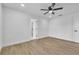 Bright bedroom with natural light, ceiling fan, and neutral flooring at 5627 Marvell Ave, Orlando, FL 32839