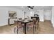 Elegant dining room with modern table setting, stylish decor, and wood floors at 5627 Marvell Ave, Orlando, FL 32839