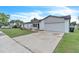 Beautiful home with a large driveway and attached garage, perfect for suburban living at 5627 Marvell Ave, Orlando, FL 32839