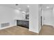 Modern kitchen with sleek black and white finishes and stainless steel appliances at 5627 Marvell Ave, Orlando, FL 32839