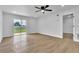 Bright and airy living room featuring wood floors, recessed lighting and a sliding glass door at 5627 Marvell Ave, Orlando, FL 32839