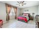 Comfortable bedroom featuring a queen-sized bed, warm lighting, and stylish decor at 591 Lake Smart Blvd, Winter Haven, FL 33881