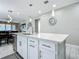 Open kitchen featuring a large island with sink and stainless steel appliances at 591 Lake Smart Blvd, Winter Haven, FL 33881