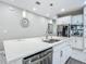 Bright kitchen island with stainless steel appliances and pendant lighting at 591 Lake Smart Blvd, Winter Haven, FL 33881