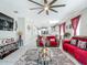 Spacious open-concept living area with modern furnishings, large ceiling fan, and plenty of natural light at 591 Lake Smart Blvd, Winter Haven, FL 33881