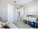 Neat office space with a cozy sofa, vintage sewing machine, and ample natural light at 591 Lake Smart Blvd, Winter Haven, FL 33881