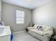 Bright office space with a comfortable sofa, natural light, and a serene atmosphere at 591 Lake Smart Blvd, Winter Haven, FL 33881