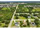 An aerial shot showcases the neighborhood and highlights its desirable location and nearby amenities at 621 Rebecca Dr, St Cloud, FL 34769
