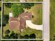 Bird's-eye view of a property with a spacious yard, mature trees, and a curved driveway at 621 Rebecca Dr, St Cloud, FL 34769