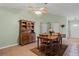 Cozy dining room featuring a wooden table, chairs, and decorative hutch at 621 Rebecca Dr, St Cloud, FL 34769