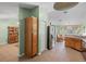 Spacious kitchen with stainless steel refrigerator and ample cabinet space at 621 Rebecca Dr, St Cloud, FL 34769