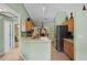 Open-concept kitchen featuring modern appliances and a breakfast bar at 621 Rebecca Dr, St Cloud, FL 34769