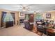 Spacious living room featuring tile floors, a stone fireplace, and a large sectional couch at 621 Rebecca Dr, St Cloud, FL 34769