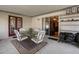 Covered patio with a table and chairs, sliding glass doors, and access to the backyard at 621 Rebecca Dr, St Cloud, FL 34769
