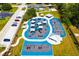 Aerial view of community playground featuring modern equipment, sun shades, and play structures at 621 Rebecca Dr, St Cloud, FL 34769