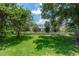 Expansive backyard featuring well-maintained lawn and a fence at 6957 Northwich Dr, Windermere, FL 34786