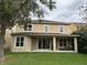 The home has a spacious backyard with a covered patio area perfect for outdoor entertaining at 6957 Northwich Dr, Windermere, FL 34786