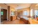 Bright bathroom with a soaking tub, shower, double sink, and a large mirror at 6957 Northwich Dr, Windermere, FL 34786
