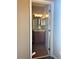 Cozy bathroom with wood cabinet vanity, framed mirror, and decorative lighting fixture at 6957 Northwich Dr, Windermere, FL 34786