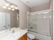 Bathroom with updated vanity, lighting, and tiled shower at 6957 Northwich Dr, Windermere, FL 34786