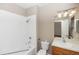 Bright bathroom featuring white shower and wood vanity sink at 6957 Northwich Dr, Windermere, FL 34786