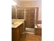 Bathroom showcasing a tiled shower, soaking tub, and vanity at 6957 Northwich Dr, Windermere, FL 34786