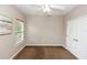 Bedroom features ceiling fan, closet, and lots of light at 6957 Northwich Dr, Windermere, FL 34786