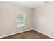 Neutral bedroom with large window and neutral carpet at 6957 Northwich Dr, Windermere, FL 34786