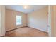 Neutral bedroom with a window and carpeted floor; ready for personalization at 6957 Northwich Dr, Windermere, FL 34786