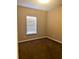 Carpeted bedroom with a window that allows natural light to illuminate the space at 6957 Northwich Dr, Windermere, FL 34786